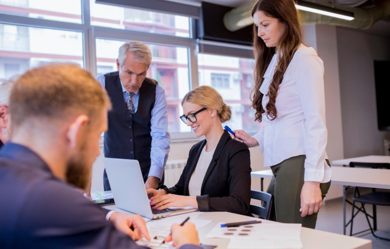 Financial professionals collaborating on risk management strategies in a modern workspace