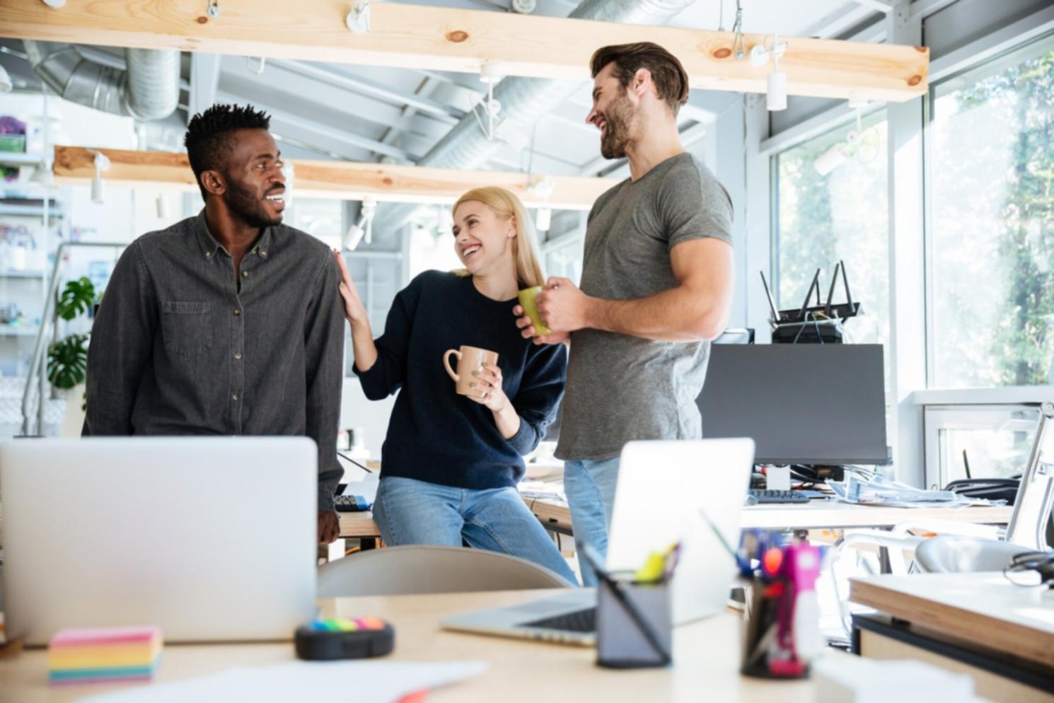 Multiple computer screens displaying financial dashboards and risk monitoring tools